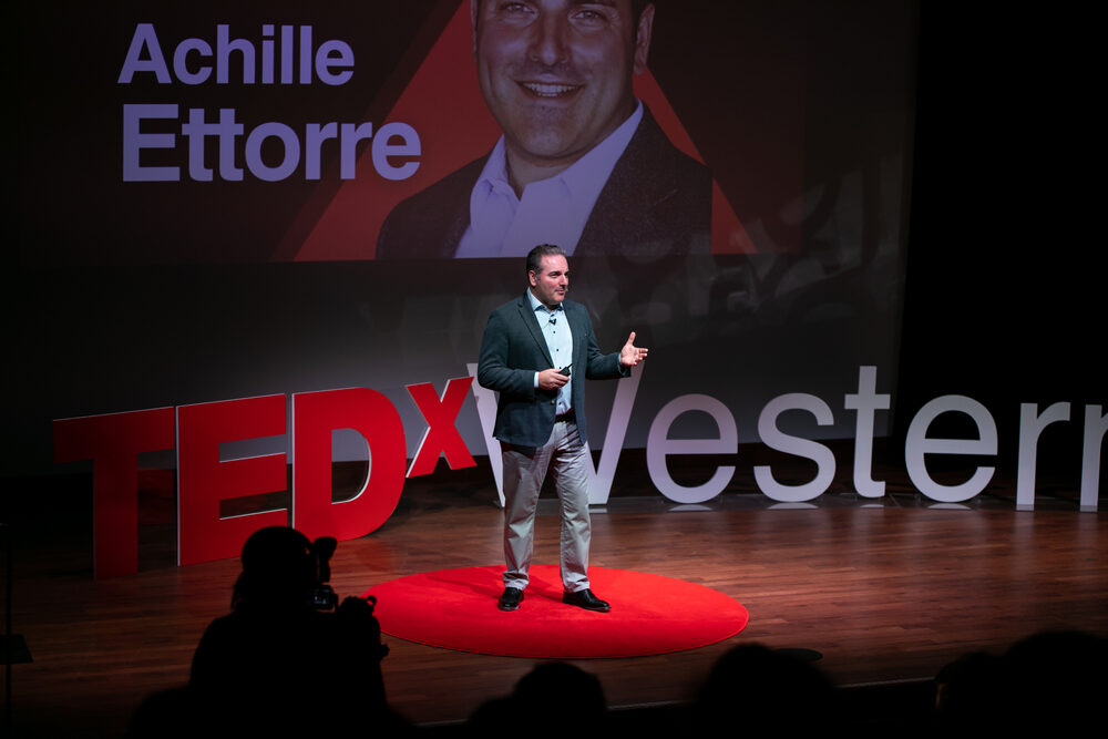 Achille Ettorre on stage addressing executives on digital transformation