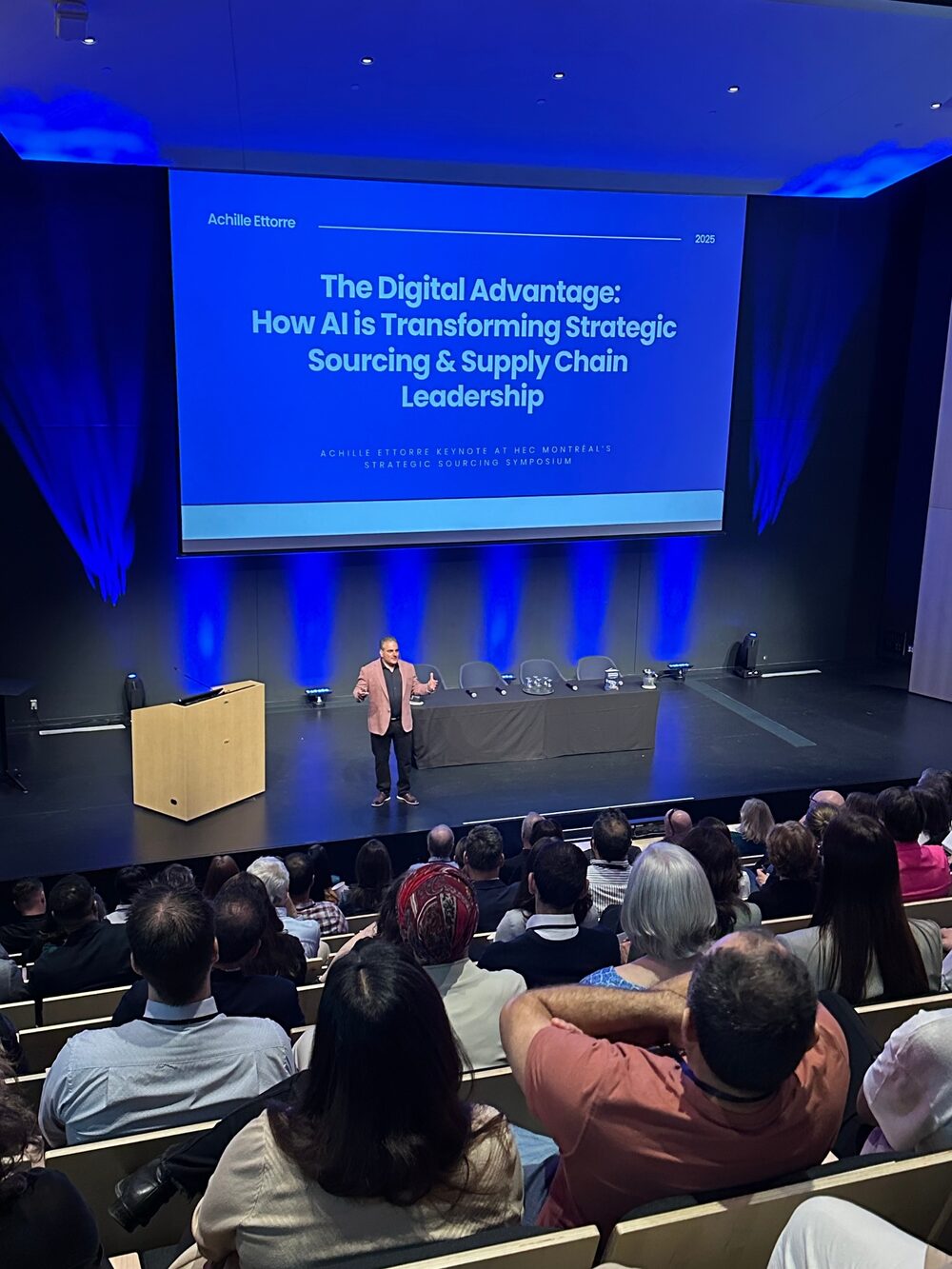 Achille Ettorre speaking at an analytics symposium