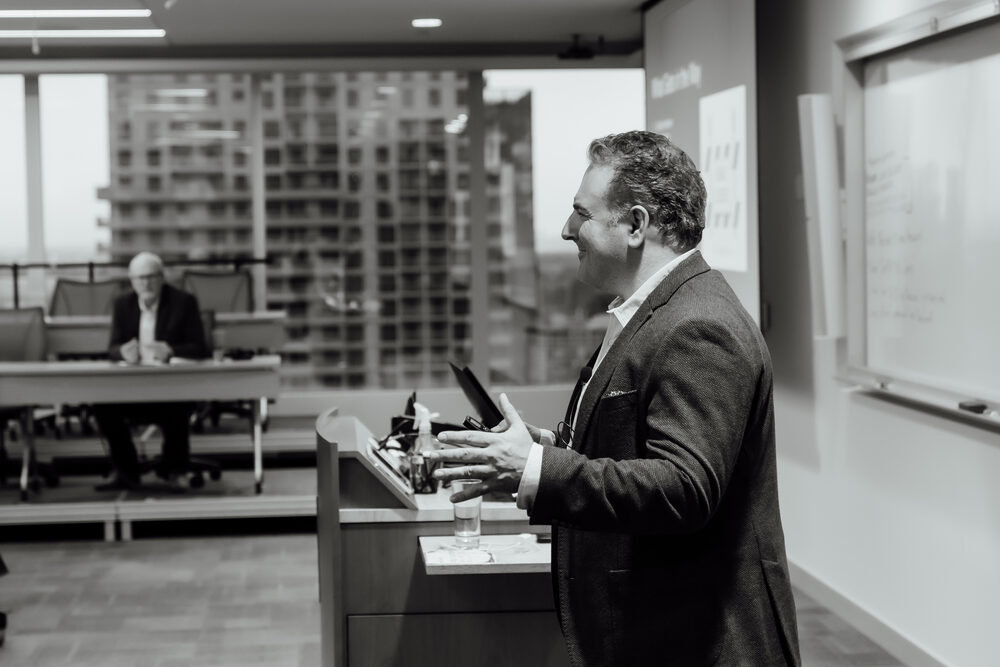 Achille Ettorre presenting an AI strategy keynote to a conference audience
