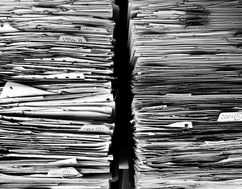 Two large stacks of paper in black and white